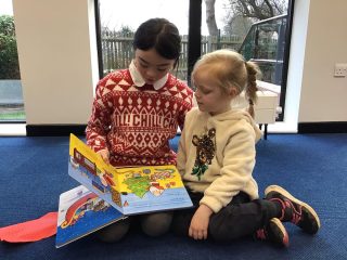 Year 6 came and read Christmas stories with Reception. We had a wonderful time.